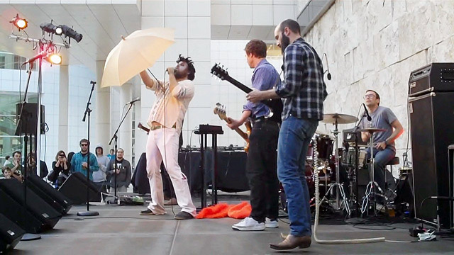 Les Savy Fav performs on the Museum Courtyard Stage Les Savy Fav's opening song, complete with Getty umbrella