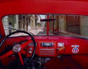 Permalink to Question of the Week: Do Americans See the World through a Distorted Lens? Sol and Cuba, Old Havana, Looking North from Alberto Roja's 1951 Plymouth, Havana, Alex Harris, negative, May 23, 1998; print, December 2007. Chromogenic print, 30 1/8 x 37 3/4 in. The J. Paul Getty Museum, 2010.90.3. Gift of Michael and Jane Wilson, Wilson Centre for Photography © Alex Harris