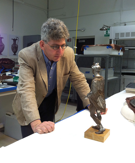 Antiquities curator Kenneth Lapatin with the Mercury statuette in the antiquities conservation studio at the Getty Villa
