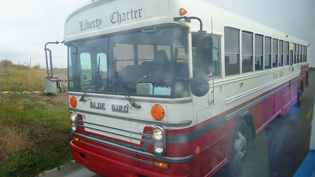A charter bus takes participants to Lita Albuquerque's Spine of the Earth 2012