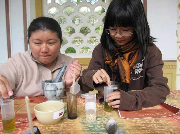 Visitors make perfumes inspired by ancient recipes during a Spicy Scents workshop at the Getty Villa