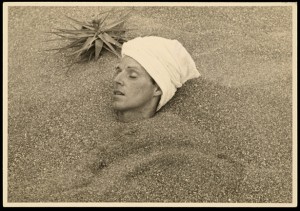 Permalink to The “Scandalous Life” of César Moro Photograph of César Moro buried up to his head in sand