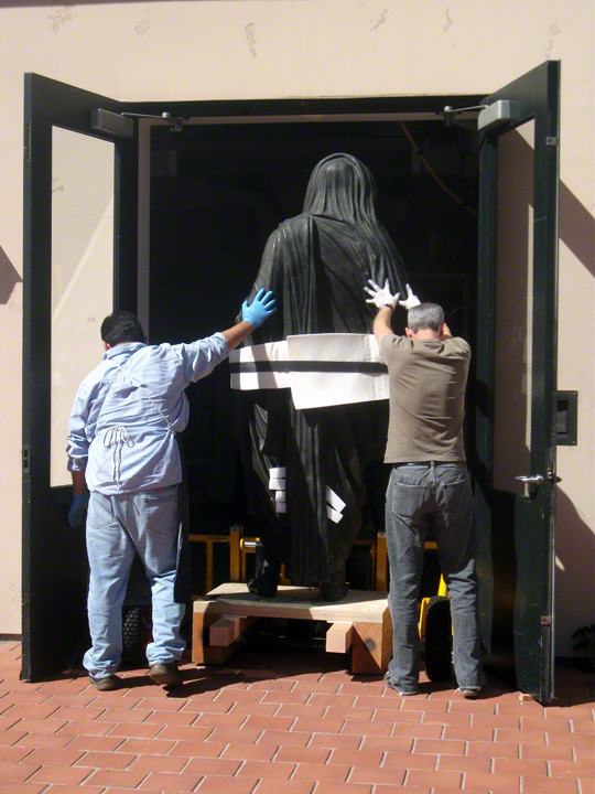 Wheeling the Statue of Tiberius into the conservation studios at the Getty Villa