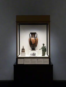 Permalink to A Winged Chariot, Wilshire Boulevard, and a Shipwreck: The Travels of Triptolemos Display case at the Getty Villa featuring Red-Figure Neck-Amphora with Triptolemos Attended by Demeter and Persephone