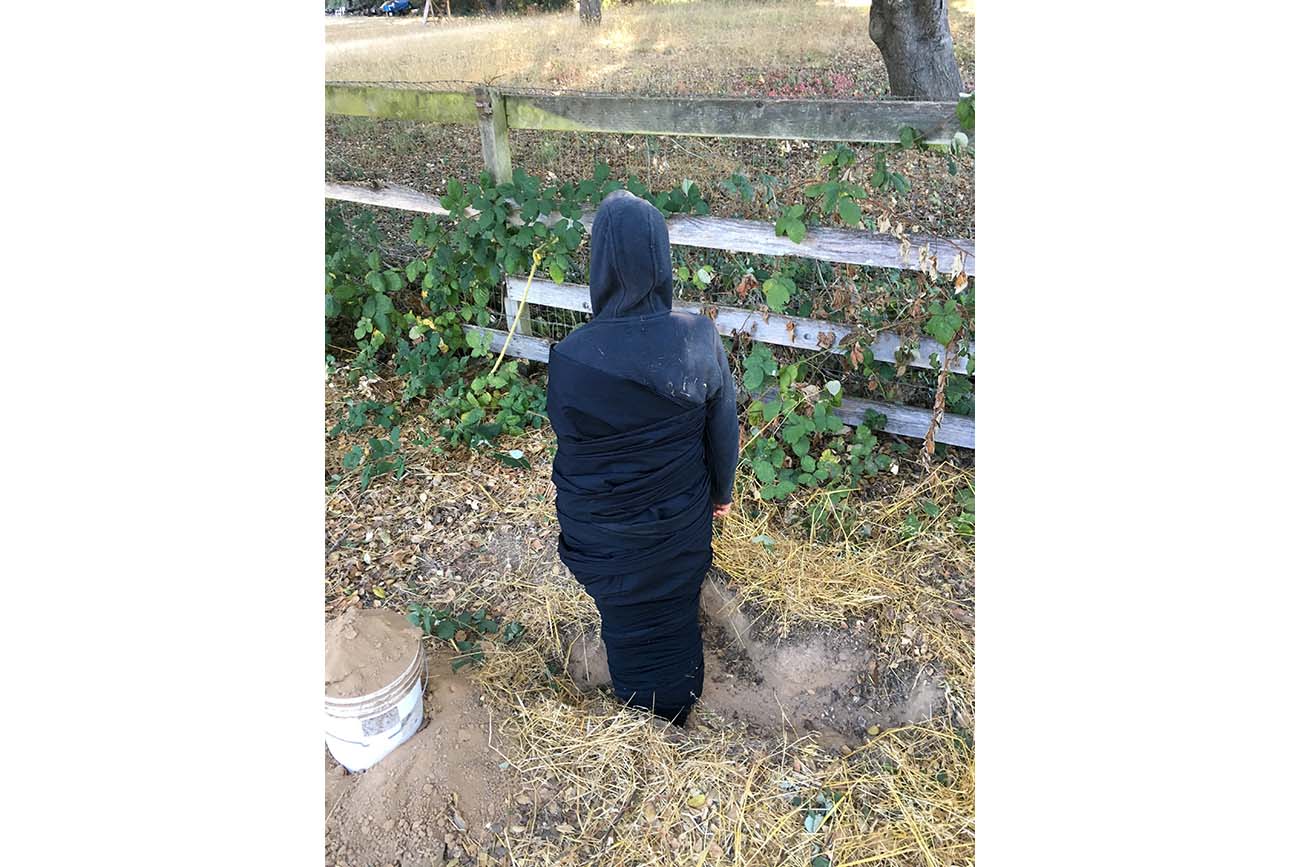 Marbles Jumbo Radio stands in a shallow, rectangular hole. Marbles Jumbo Radio stands in a shallow, rectangular hole.