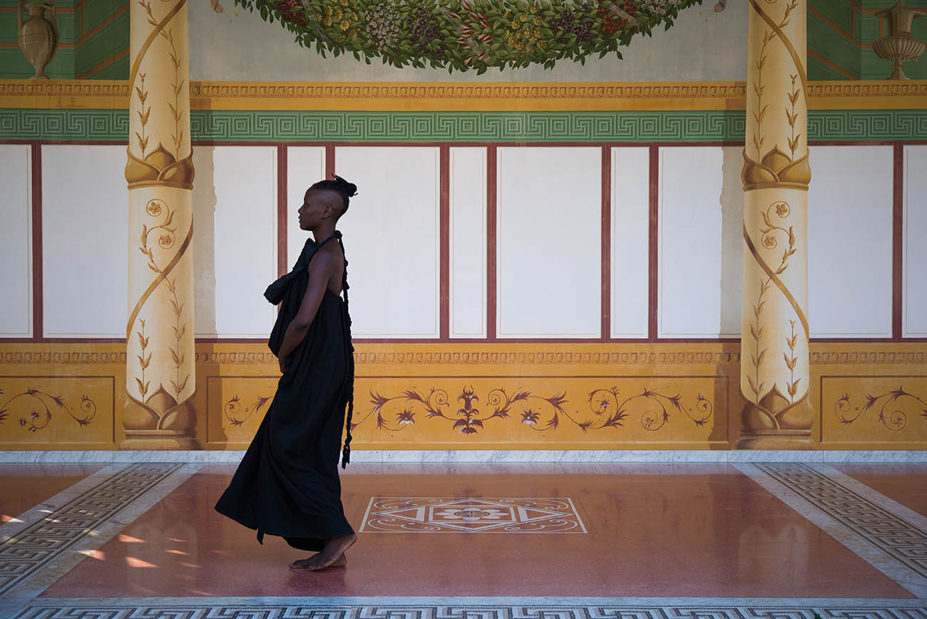 taisha paggett walks in the covered walkway surrounding the Getty Villa's Outer Peristyle Garden. taisha paggett walks in the covered walkway surrounding the Getty Villa's Outer Peristyle Garden.