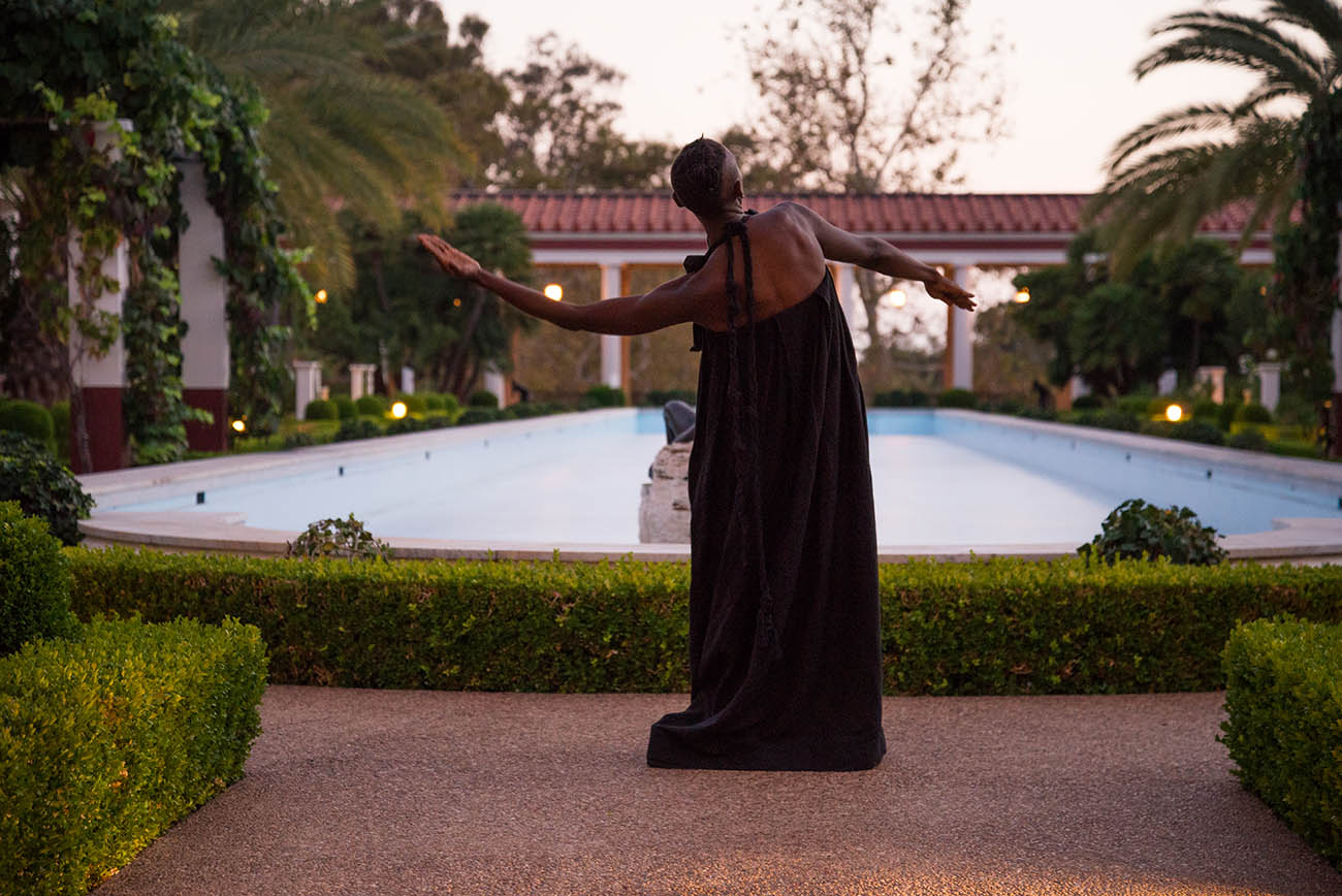 As dusk falls, taisha paggett dances near the fountain in the Getty Villa's Outer Peristyle Garden. As dusk falls, taisha paggett dances near the fountain in the Getty Villa's Outer Peristyle Garden.