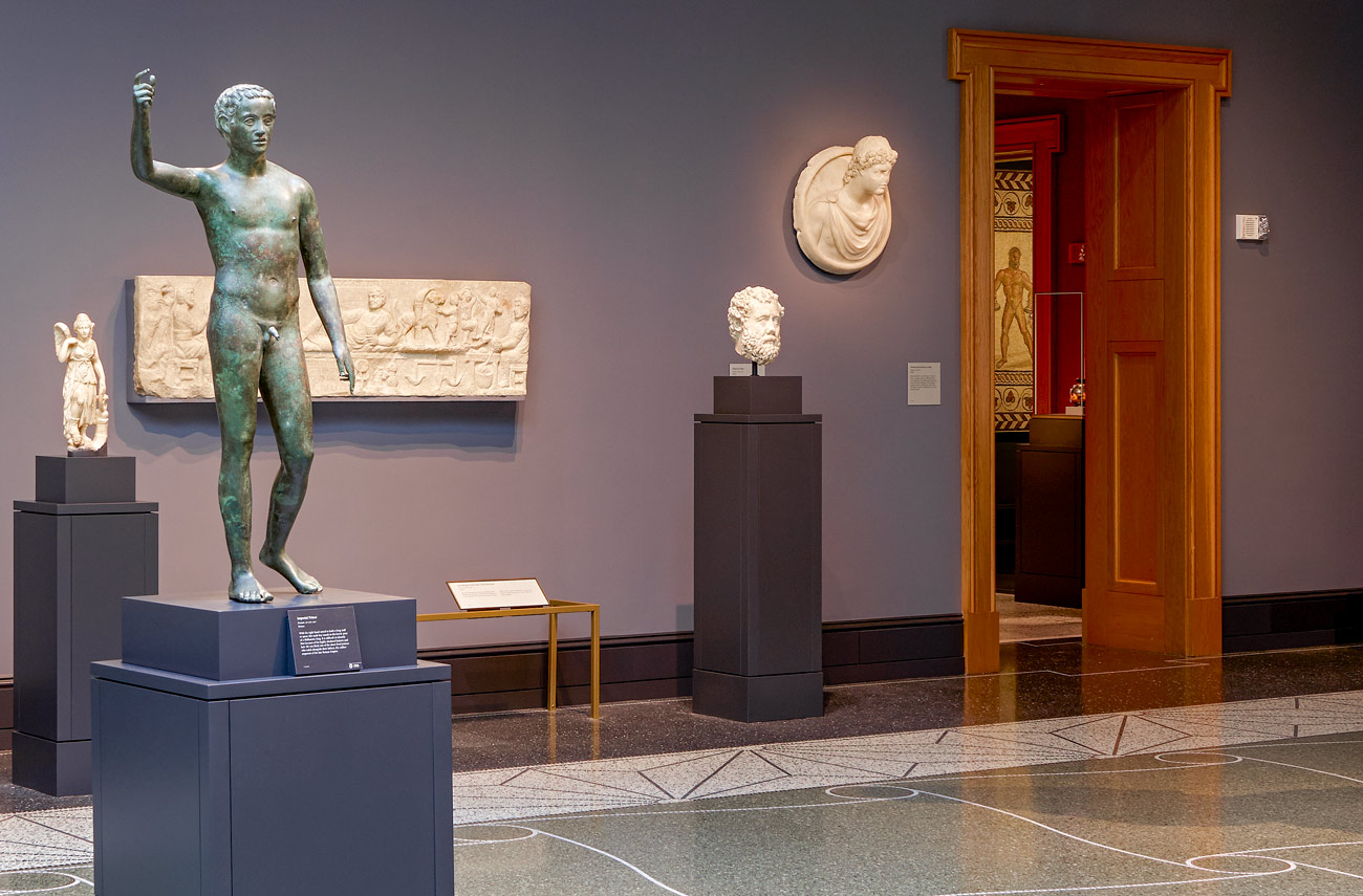 A gallery with Ancient Greek sculptures and paintings.